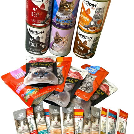 Assorted cat food cans and packets on a green surface