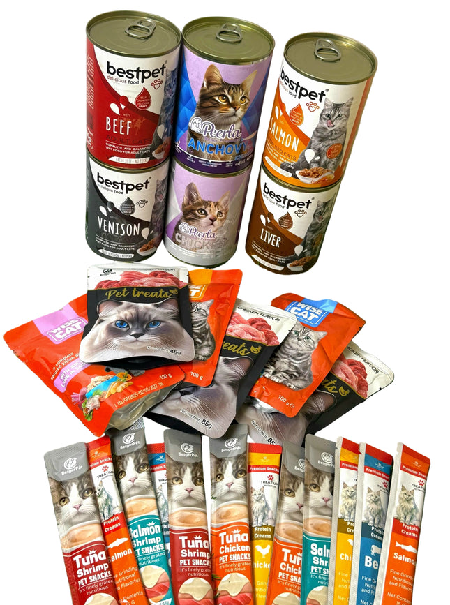Assorted cat food cans and packets on a green surface